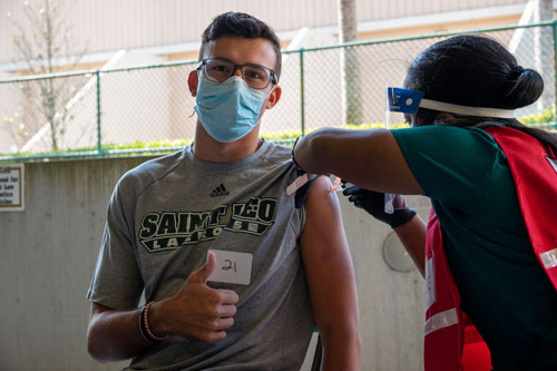 Graduate-student-and-lacrosse-player-Jack-Spera-receives-his-vaccine-w